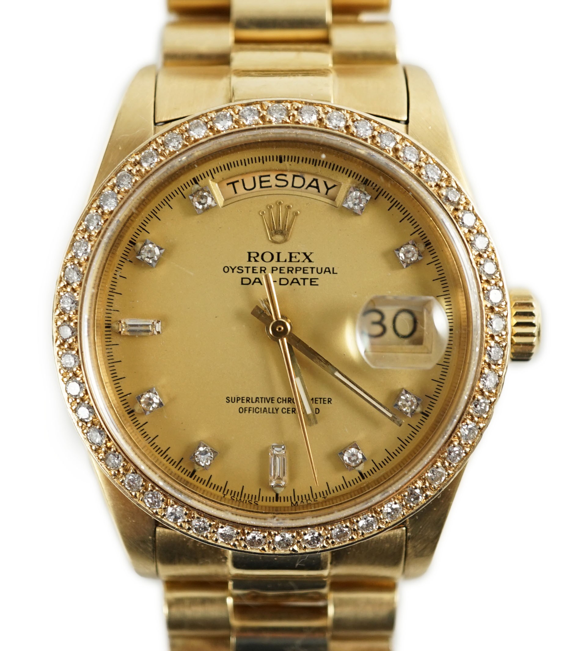 A gentleman's late 1970's 18ct gold Rolex Oyster Perpetual Day-Date wrist watch, with after market diamond set bezel and diamond set markers, on an 18ct gold Rolex bracelet with deployment clasp
